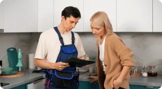 Technician explaining appliance repair process to customer in Cupertino